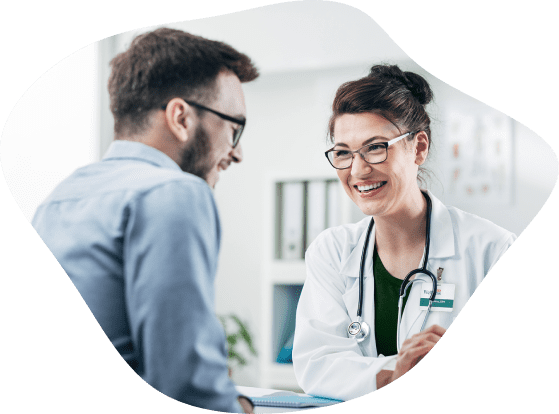 A physician speaks with a patient